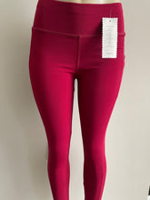 Load image into Gallery viewer, Front of Candy red leggings with pocket for women - high-performance and comfortable activewear for intense workouts and outdoor activities.
