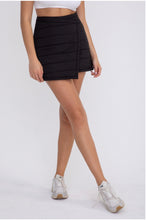 Load image into Gallery viewer, Women wearing black padded puffer wrap-around active skirt.
